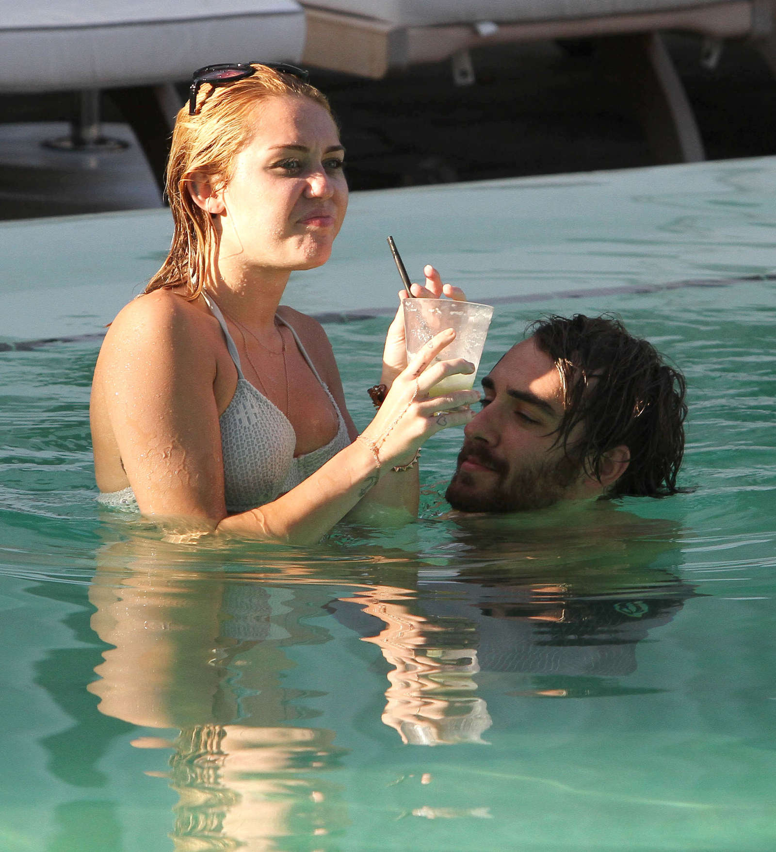 Miley Cyrus - Bikini at a Hotel Pool with Liam in Miami